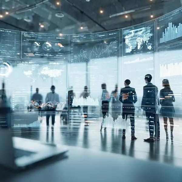 Equipo de profesionales analizando paneles digitales con datos y métricas en un entorno corporativo moderno, simbolizando la gestión estratégica de recursos humanos basada en análisis y tecnología.